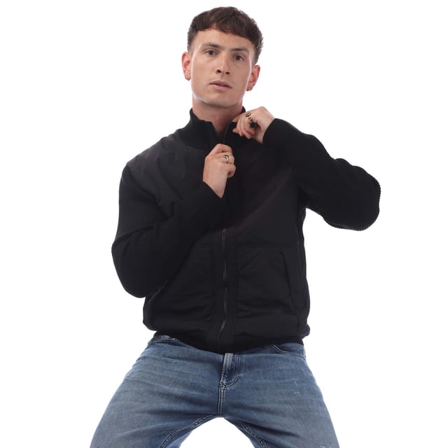 Mens Hugo Boss Kydalnrio Hybrid Jacket in black.- Funnel neck.- Full zip fastening.- Two front pockets.- Ribbed cuffs and hem.- Nylon front.- Square Boss badge on the chest.- Knitted.- 40% Acrylic  39% Virgin Wool  18% Polyamide  3% Elastane.- Ref: 50531494001
