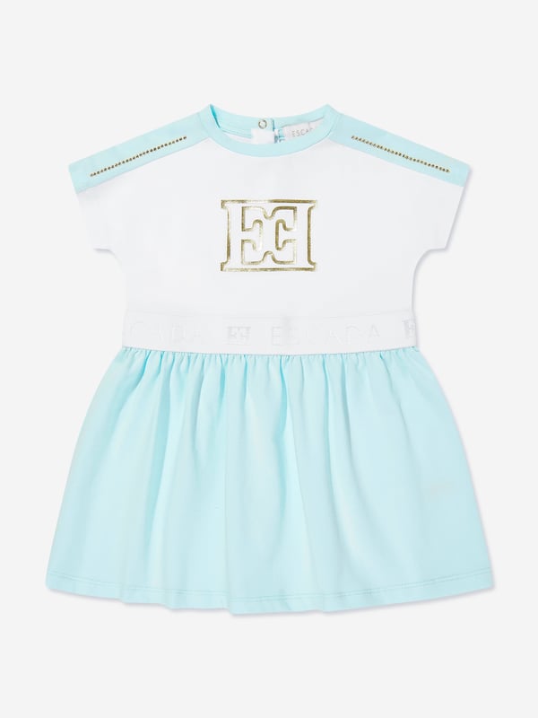 Introducing the Escada Baby Girls Logo Dress in White, the epitome of luxury for the littlest fashionistas. Crafted for SS2025, this designer piece elevates any baby girl's wardrobe to a splendid echelon. Key features include Elegant White Hue Pristine and classy, perfect for any occasion. Premium Fabric Exceptionally soft, ensuring all-day comfort. Iconic Logo Detail Subtly showcases the prestigious Escada brand, adding a touch of exclusivity. Timeless Design Combines modern trends with classic elegance.Upgrade her style with this exquisite dress from Escada. Buy now for a touch of luxury!