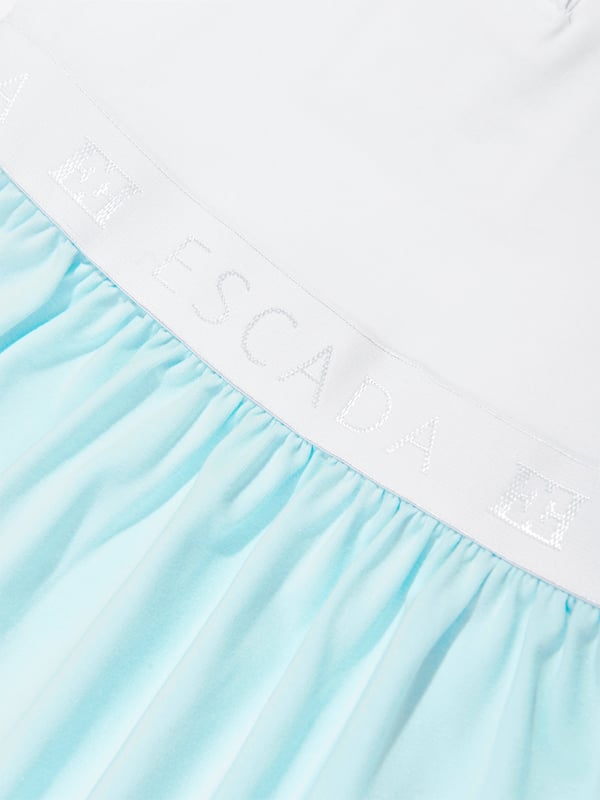 Introducing the Escada Baby Girls Logo Dress in White, the epitome of luxury for the littlest fashionistas. Crafted for SS2025, this designer piece elevates any baby girl's wardrobe to a splendid echelon. Key features include Elegant White Hue Pristine and classy, perfect for any occasion. Premium Fabric Exceptionally soft, ensuring all-day comfort. Iconic Logo Detail Subtly showcases the prestigious Escada brand, adding a touch of exclusivity. Timeless Design Combines modern trends with classic elegance.Upgrade her style with this exquisite dress from Escada. Buy now for a touch of luxury!