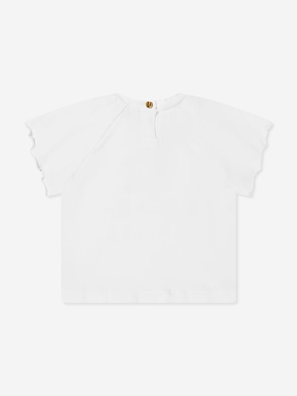 Introducing Escada's Baby Girls Embroidered Logo T-Shirt in pristine white for SS2025. A luxurious staple for the tiny trendsetters wardrobe, splendidly capturing the essence of high-end simplicity. Key features include Exquisite Embroidery Features the iconic Escada logo delicately embroidered, adding a touch of elegance. Luxurious Comfort Crafted from superior soft cotton, ensuring comfort for all-day wear. Versatile Style Perfect for any occasion, from playdates to parties.Elevate your little girl's ensemble with this timeless piece from Escada.