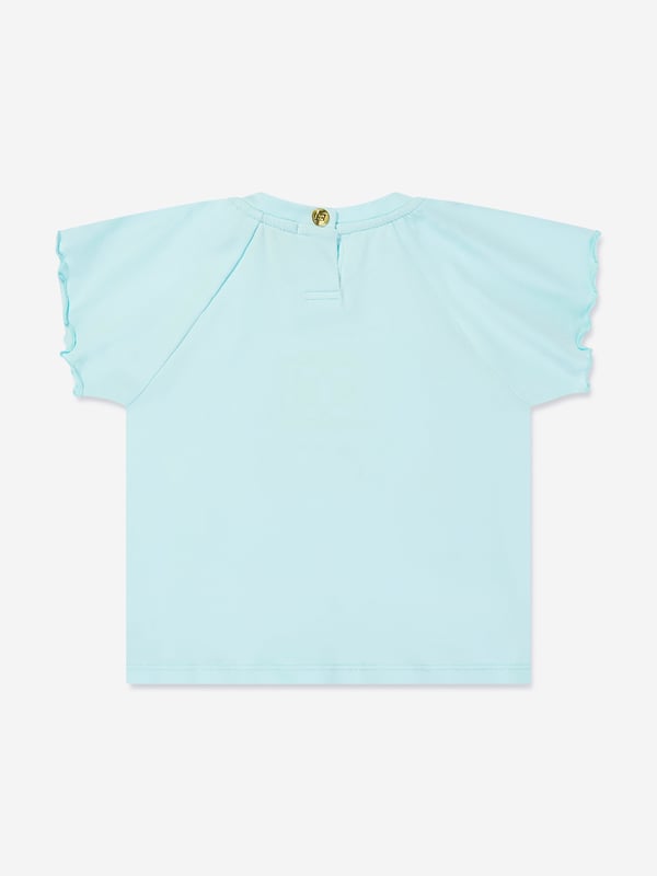 Introducing the Escada Baby Girls Embroidered Logo T-Shirt in Blue, an exquisite addition to your little princess's wardrobe for SS2025. Revel in the charm and class of this essential piece Exquisite Embroidery Features the iconic Escada logo delicately embroidered, adding a touch of luxury. Premium Fabric Crafted from the finest materials, ensuring comfort durability for all-day wear. Versatile Shade A beautiful blue hue that complements any outfit, making it a versatile staple. Perfect for Special Occasions Ideal for garden parties or family gatherings.Elevate her style with Escada's sophistication.