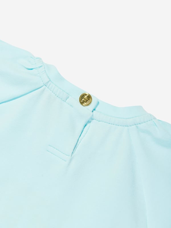 Introducing the Escada Baby Girls Embroidered Logo T-Shirt in Blue, an exquisite addition to your little princess's wardrobe for SS2025. Revel in the charm and class of this essential piece Exquisite Embroidery Features the iconic Escada logo delicately embroidered, adding a touch of luxury. Premium Fabric Crafted from the finest materials, ensuring comfort durability for all-day wear. Versatile Shade A beautiful blue hue that complements any outfit, making it a versatile staple. Perfect for Special Occasions Ideal for garden parties or family gatherings.Elevate her style with Escada's sophistication.