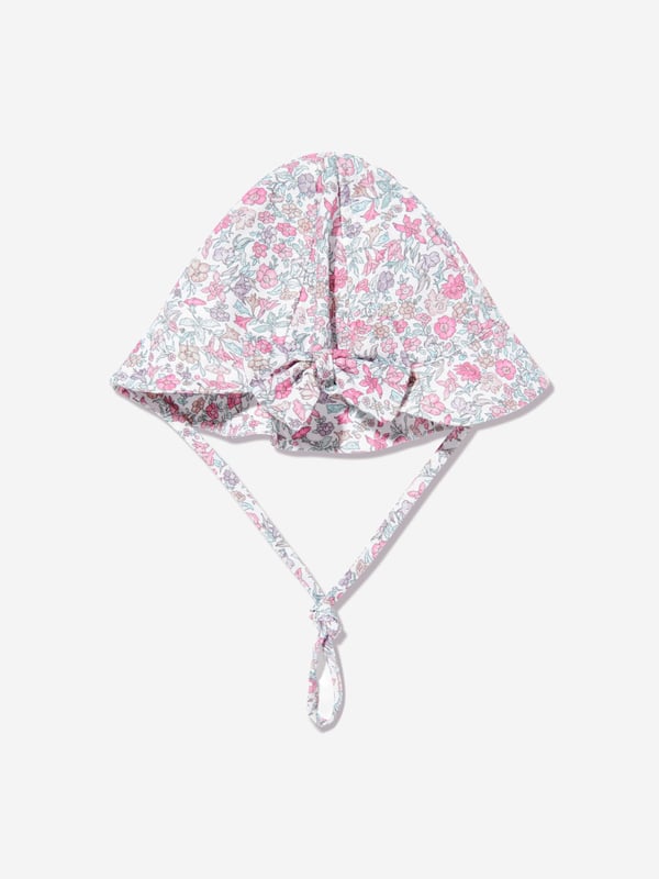 Introducing the enchanting Baby Girls Floral Hat in Pink by Paz Rodriguez, a quintessential addition to your little darling's wardrobe for SS2025. Crafted with precision in Spain, this exquisite hat promises to elevate your baby girl's style quotient. Here are its standout features Exclusively Spanish Meticulously designed and produced in Spain, offering unparalleled craftsmanship and enduring quality. Charming Floral Design Embellished with a delightful floral motif, adding a splash of cheerfulness and elegance. Perfectly Pink Rendered in a soft pink hue, it ensures your little one looks adorable and on-trend. Comfort Meets Style Constructed from premium materials for comfort, ensuring it's as cosy as it is stylish.Gift your child a touch of Spanish luxury and style with this delectable Baby Girls Floral Hat in Pink from Paz Rodriguez. Perfect for SS2025!