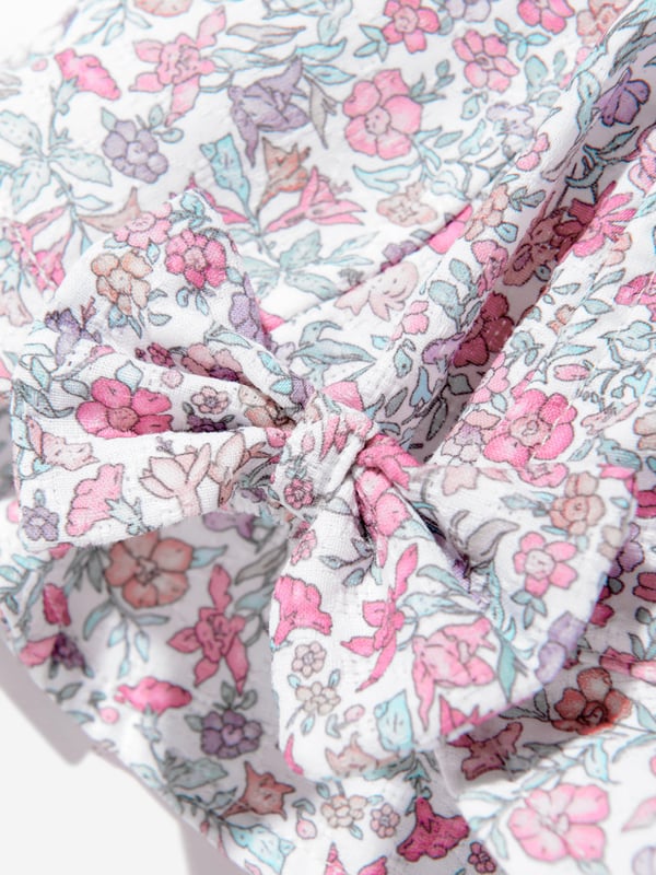 Introducing the enchanting Baby Girls Floral Hat in Pink by Paz Rodriguez, a quintessential addition to your little darling's wardrobe for SS2025. Crafted with precision in Spain, this exquisite hat promises to elevate your baby girl's style quotient. Here are its standout features Exclusively Spanish Meticulously designed and produced in Spain, offering unparalleled craftsmanship and enduring quality. Charming Floral Design Embellished with a delightful floral motif, adding a splash of cheerfulness and elegance. Perfectly Pink Rendered in a soft pink hue, it ensures your little one looks adorable and on-trend. Comfort Meets Style Constructed from premium materials for comfort, ensuring it's as cosy as it is stylish.Gift your child a touch of Spanish luxury and style with this delectable Baby Girls Floral Hat in Pink from Paz Rodriguez. Perfect for SS2025!