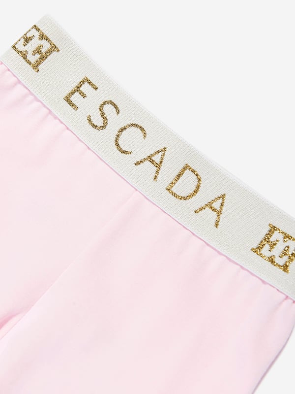 Introducing the exquisite Escada Baby Girls Logo Leggings in Pink a quintessential addition to any young fashionista's SS2025 wardrobe. Fashioned from superior materials, these leggings promise both unparalleled comfort and chic sophistication. Delight in their key features Distinctive Logo Detail Embossed with the iconic Escada logo for an authentic designer touch. Luxurious Comfort Crafted with the softest fabrics to ensure your little one enjoys every moment in sheer comfort. Perfectly Pink A vibrant shade that radiates charm and style.Elevate your child's ensemble with a piece that blends luxury with playful flair. Secure a pair today!