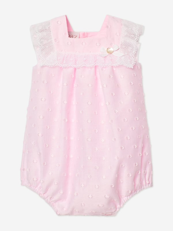 Discover the charm of the Paz Rodriguez Baby Girls Lace Trim Romper in Pink, a sublime addition to your little darling's SS2025 wardrobe. Exquisitely crafted in Spain, this romper merges tradition with a splash of contemporary chic. Crafted in Spain Impeccably made with premium materials for comfort and longevity. Delicate Pink Hue A soft, feminine colour perfect for any occasion. Elegant Lace Detailing Adds a touch of sophistication and timeless grace.Transform your baby girl's attire with this enchanting romper by Paz Rodriguez and let her step into SS2025 with style and elegance.