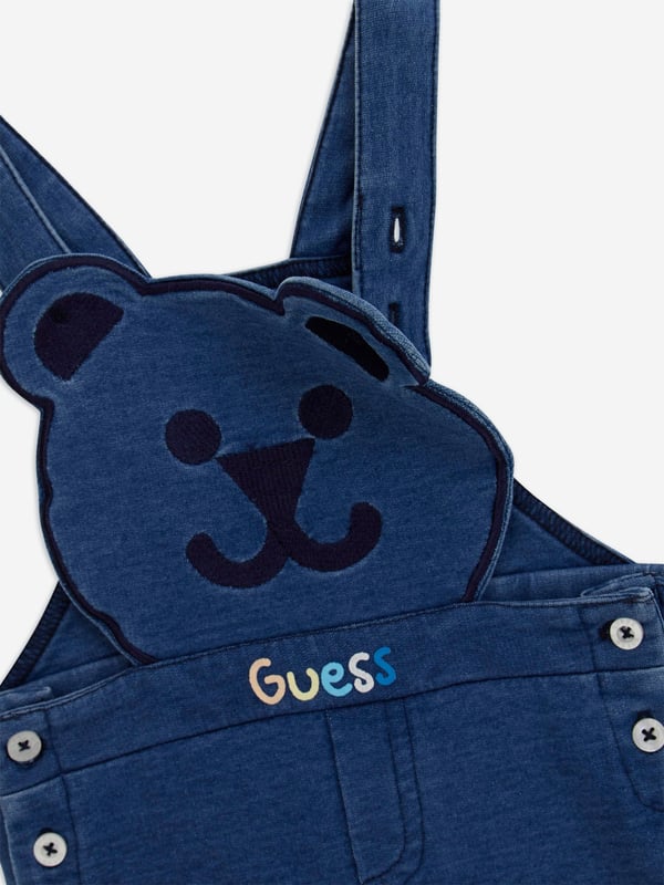 Discover elegance charm with the Guess Baby Boys Dungaree Set in Blue, an exquisite addition for SS2025. Perfectly tailored for your cherished little one, this set epitomizes both comfort panache. Key features include Classic Blue Hue A sophisticated, timeless colour, ideal for any occasion. Luxurious Comfort Crafted from premium fabrics to ensure all-day ease freedom of movement. Signature Guess Style Unmistakably chic with attention to detail, enhancing your boys wardrobe.Elevate his ensemble with this quintessentially stylish set!