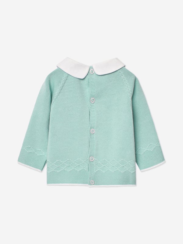 Paz Rodriguez depict high quality and fine detailing into their traditional aesthetics. This baby boys water green trouser set captures the label's sleek, innovative outlook. Engineered in refined knit. The sweater features a classic white collar with pearlescent shell buttons and white trims. The matching trousers come with an elasticated waistband. Made in Spain Two Piece Set 100 Cotton