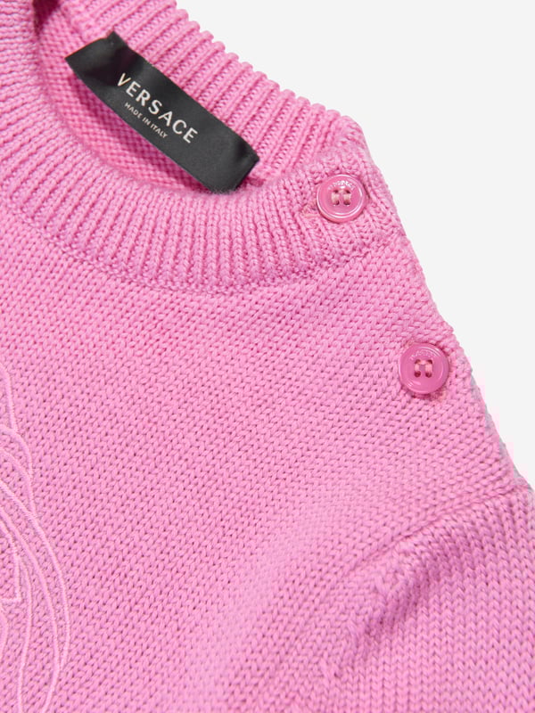 Versace's Italian portraits embody fine detailing and impeccable construction. This baby girls pink paradise jumper captures the label's eccentric personality and passion for manipulating Greek abstracts into fashionable pieces. Made in pure virgin wool, it has been depicted with a subtle Medusa motif embroidery in the centre. Little ones will look effortlessly stylish and sophisticated. Medusa Kids Embroidery Long Sleeves Shoulder Button Closure Elasticated Cuffs and Hem Outer Composition 100 Pure Virgin Wool Embroidery 100 Viscose Hand Wash Gently Using Mild Detergent Do Not Bleach Do Not Tumble Dry Dry Flat Cool Iron On Reverse With Damp Cloth On Top Do Not Dry Clean Wash Inside Out Do Not SoakVersace Size Child's Height 03M 22" 56 cm 36M 24.5" 62 cm 69M 27" 68 cm 912M 29" 74 cm 1218M 31.5" 80 cm 1824M 34" 86 cm 2A 36" 92 cm 3A 38.5" 98 cm