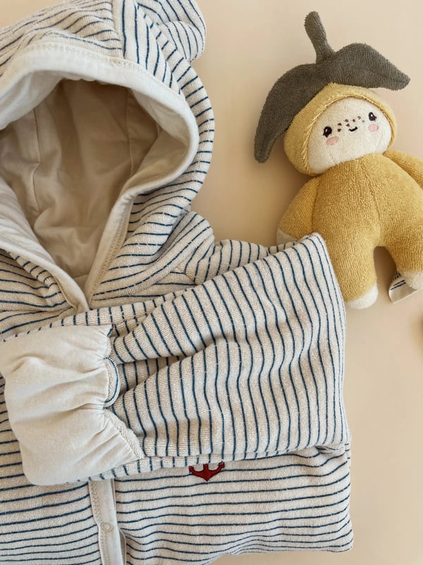 Introducing the Baby Mini Lemon Soft Toy from renowned designer Konges Slojd, a delightful addition to your unisex baby's nursery! Encased in a beautiful ivory hue, this high-caliber creation brings a touch of luxury to childcare. Unique Design This exquisite Soft Toy in a vivid yellow lemon shape provides chic contemporary appeal, adding a refreshing splash of colour to any nursery setting. Soft and Safe Carefully tailored from top-quality materials, this toy guarantees optimum safety and plush cosiness for your precious little one's endless explorations. Perfect Nursery Adornment With its playful design and plush comfort, the Baby Mini Lemon Soft Toy is not only a fantastic plaything, but also a charming décor accessory for your baby's nursery.Transform your baby's playtime with this endearing designer soft toy. Order now for a nursery as stylish as your beloved child!