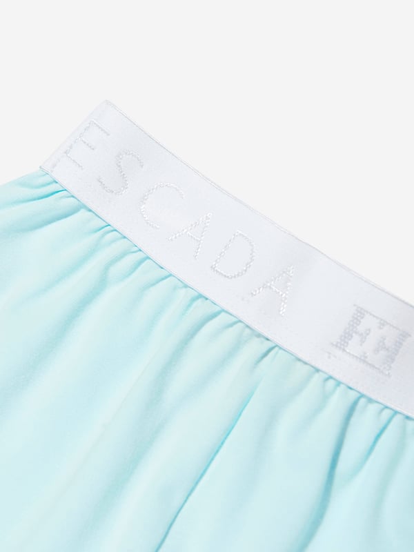 Introducing the enchanting Baby Girls Embroidered Logo Shorts in Blue by Escada, a quintessential addition to her SS2025 wardrobe. Crafted with meticulous attention to detail, these shorts exemplify luxury and charm for any young lady. Highlight features include Exquisite Embroidery Featuring the iconic Escada logo beautifully stitched, embodying elegance. Premium Fabric Constructed from superior quality materials, ensuring comfort and durability. Striking Blue Hue A vibrant blue colour makes these shorts a versatile and stylish choice.Elevate her collection with these striking Escada shorts a blend of sophistication and playfulness.