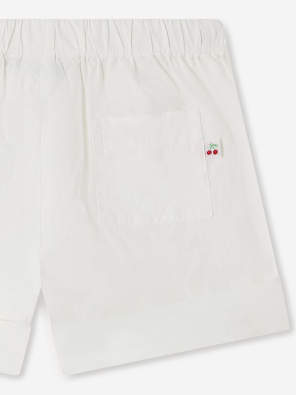 Discover the charm of the Baby Girls Ecandy Shorts in White by Bonpoint, an essential addition to any fashionable young wardrobe for SS2025. Elegance and comfort merge in this luxurious design, tailor-made for your little princess. Pristine White A timeless, versatile shade that offers endless styling options. Superior Fabric Crafted from the finest materials ensuring softness and durability. Iconic Style Bonpoint's signature chic ensures your baby girl is always dressed in top-notch fashion. Elevate her summer look with these exquisite shorts!