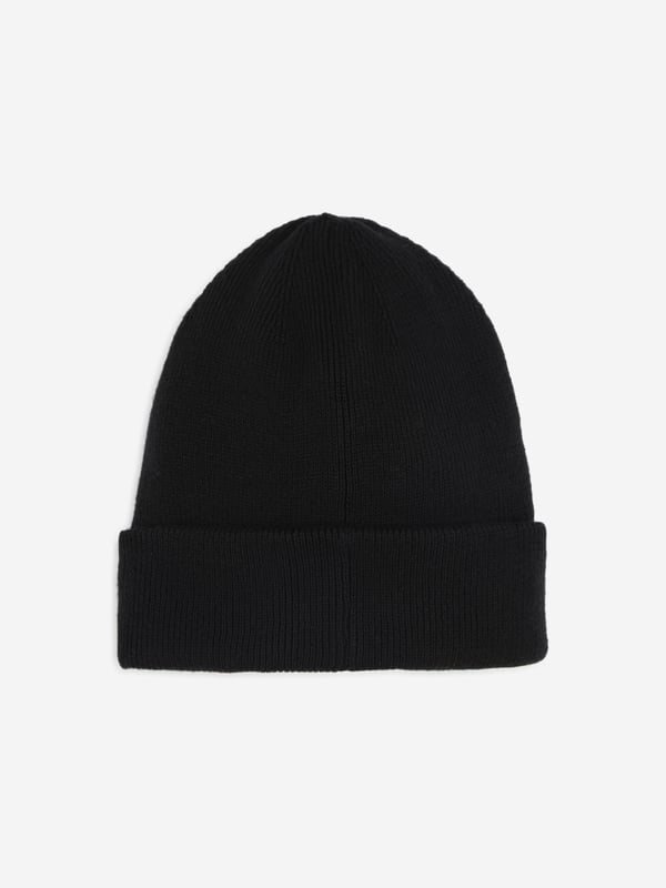 Introducing the Boys Knitted Logo Beanie Hat in Black by BOSS, an essential addition for any discerning young wardrobe for AW2024. Perfect for keeping Cosy and stylish, this beanie ensures your boy stands out with elegant simplicity. Here are its standout features Iconic BOSS Branding Features a discreetly embossed logo for a touch of luxury. Premium Knit Fabric Crafted from superior quality fibers for durability and warmth. Versatile Design Classic black hue matches effortlessly with any outfit. Ultimate Comfort Soft texture that is gentle on the skin, perfect for everyday wear.Elevate his style this season with the Boys Knitted Logo Beanie Hat in Black. Secure yours today!