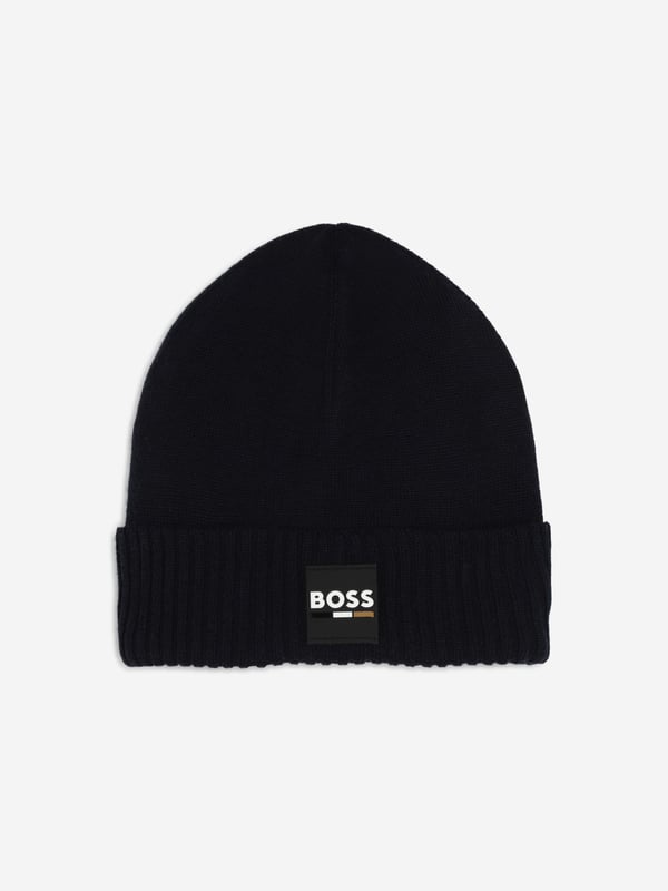 Introducing the Boys Logo Badge Beanie Hat in Navy by BOSS, the perfect addition for stylish warmth in AW2024. Sophisticated yet playful, this designer beanie is a stellar pick for any young trendsetter's wardrobe. Here are the standout features Iconic BOSS Logo Features a prominent, chic badge enhancing its designer appeal. Premium Fabrication Crafted from luxurious, soft materials to keep warm while ensuring comfort. Deep Navy Blue A versatile and classic colour that matches effortlessly with various outfits. Durable Design Built to last, ideal for seasonal adventures and day-to-day wear.Refresh your boy's look this season with this stylish beanie from BOSS. Order now to add a touch of designer flair to his cold-weather ensemble!