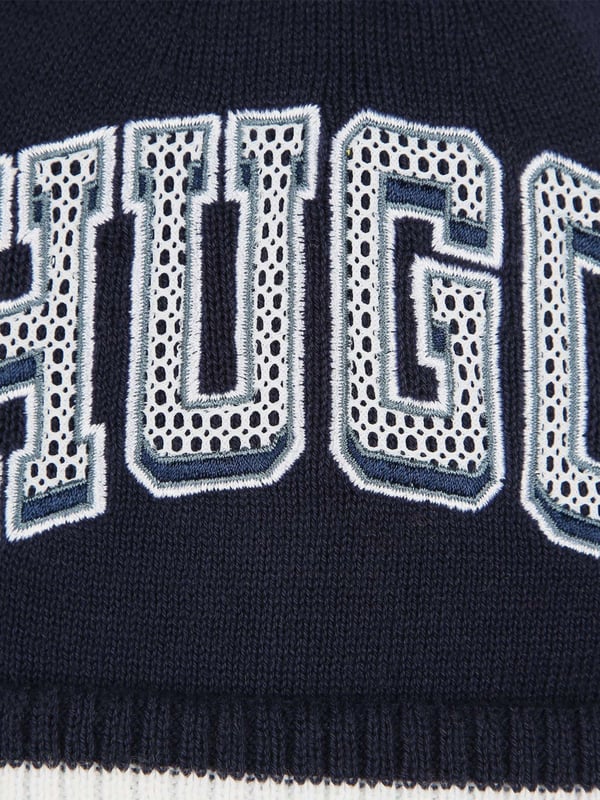 Introducing the Hugo Hoodie in majestic blue tailored for boys for AW2024. Exquisitely crafted, this piece melds luxury with practicality to elevate any young wardrobe. Heres why it's indispensable Vibrant Azure Hue Captures the richness of the season in a compelling, stylish shade of blue. Premium Fabric Blend Ensures durability and all-day comfort, ideal for energetic boys. Contemporary Cut A modern, clean design that seamlessly fits with other wardrobe pieces.revitalise your boy's collection with the Hugo Hoodie in blue. Order nowlet him shine in sophistication this AW2024!