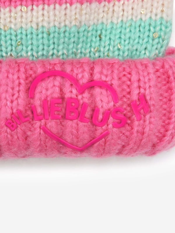 Introducing the Billieblush Girls Striped Sequin Bobble Hat in Pink your new essential for AW2024. Designed to dazzle and crafted for comfort, this hat elevates every young fashionista's cold-weather collection. Radiant Sequin Details Adds a shimmering sparkle that catches the eye. Playful Pink Stripes Vibrant and fun, perfect for brightening up gray winter days. Cosy Knit Fabric Keeps your little one snug and warm. Signature Bobble Feature A delightful touch that brings whimsy to winter wear. Premium Craftsmanship Ensures durability and lasting style.Brighten up her winter wardrobe with this charming and stylish accessory from Billieblush. Order now and embrace the chill with flair!