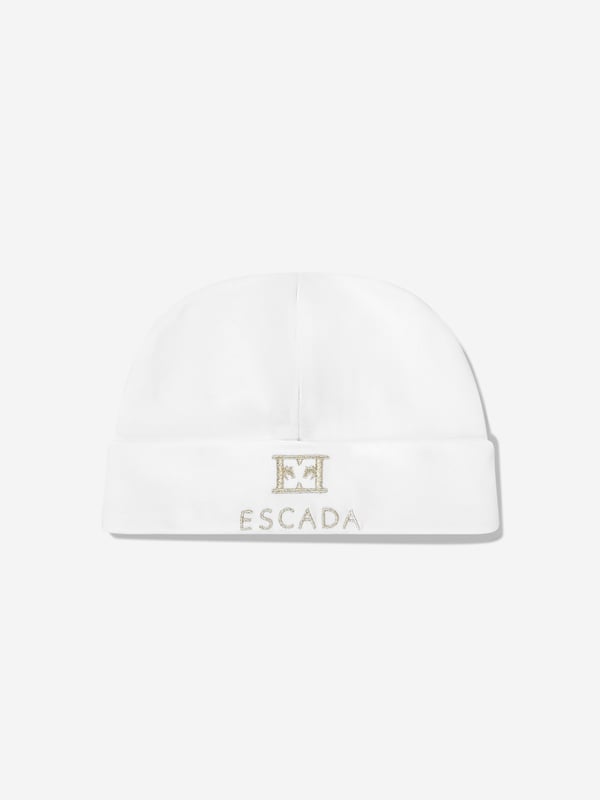 Elevate your little darling's style with the exquisite Baby Girls Embroidered Logo Beanie in White by Escada, a splendid addition for SS2025. Each beanie combines understated elegance and comfort. Key highlights include Luxurious Embroidery Features the iconic Escada logo intricately embroidered, adding a touch of luxury. Premium Material Crafted from the finest fabrics to ensure warmth and comfort against your baby girl's delicate skin. Versatile White A chic, crisp white that complements any outfit, making it perfect for any occasion. Add a flare of sophistication to your baby girls ensemble with this must-have designer beanie.