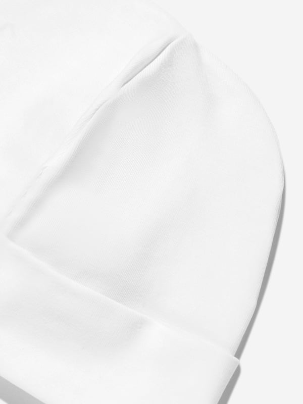 Elevate your little darling's style with the exquisite Baby Girls Embroidered Logo Beanie in White by Escada, a splendid addition for SS2025. Each beanie combines understated elegance and comfort. Key highlights include Luxurious Embroidery Features the iconic Escada logo intricately embroidered, adding a touch of luxury. Premium Material Crafted from the finest fabrics to ensure warmth and comfort against your baby girl's delicate skin. Versatile White A chic, crisp white that complements any outfit, making it perfect for any occasion. Add a flare of sophistication to your baby girls ensemble with this must-have designer beanie.