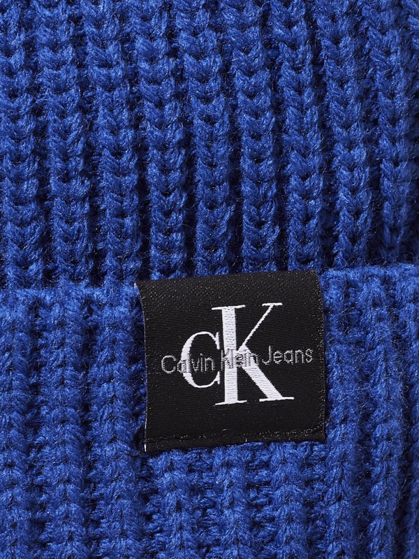 Introducing the Boys Monogram Rib Beanie Hat in Blue, crafted by Calvin Klein Jeans a premier accessory for the discerning young wardrobe for AW2024. Experience sophistication and cosy warmth with every wear Signature Monogram Design Features Calvin Klein's iconic logo in a subtle, stylish monogram pattern. Luxe Fabric Blend Constructed with premium materials, ensuring a soft touch and durable wear. Vibrant Blue Hue A striking blue colour that complements any outfit, making it both versatile and fashionable. Perfect Fit Ribbed knit offers a snug, comfortable fit that stays in place during all activities.Revamp your boy's style statement with this sophisticated and chic beanie. Ideal for chilly days and cool evenings, let him showcase his flair in Calvin Klein comfort and style!