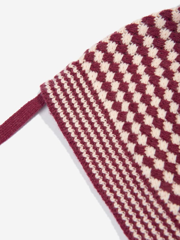 Introducing the luxurious Baby Girls Hazel Chunky Checker Hat in Berry from the bonnie mob. Crafted in vibrant purple, this sumptuous accessory is essential for AW2024, blending high fashion with practical warmth. Ultra-soft Texture Crafted for comfort with premium fabrics. Bold Checker Design Eye-catching pattern ensures your little one shines. Perfect Fit Designed to snugly and securely cocoon a baby's head. Durable Easy-Care Withstands frequent washing, retaining its charm.Elevate your little girl's style quotient this season with the Hazel Chunky Checker Hat. Perfect fashion meets function!