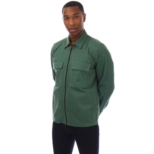 Mens Hugo Boss Lovel 15 Overshirt in green.- Classic collar.- Full zip fastening.- Two front chest pockets.- BOSS logo patch on the left chest.- Regular fit. - 100% Cotton.- Ref: 50530853343