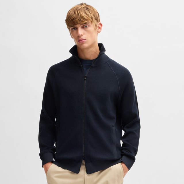 Mens BOSS H-Domico Zip-Up Cardigan in cotton and virgin wool in dark blueA zip-front cardigan with contrasting ribbing by BOSS. This layer is cut to a regular fit and blended with soft virgin wool. This product is partly made with organic cotton. Our organic standards do not allow the use of synthetic fertilisers  pesticides or genetically modified seeds.- Regular fit- Zip neck- Long sleeves- Pockets top: Zip pockets- Standard length- Main material: 70% Cotton  30% Virgin wool.  Ribbing: 100% Polyester.  Machine washable.- Ref: 50519629-405