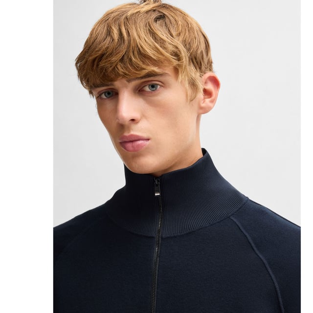 Mens BOSS H-Domico Zip-Up Cardigan in cotton and virgin wool in dark blueA zip-front cardigan with contrasting ribbing by BOSS. This layer is cut to a regular fit and blended with soft virgin wool. This product is partly made with organic cotton. Our organic standards do not allow the use of synthetic fertilisers  pesticides or genetically modified seeds.- Regular fit- Zip neck- Long sleeves- Pockets top: Zip pockets- Standard length- Main material: 70% Cotton  30% Virgin wool.  Ribbing: 100% Polyester.  Machine washable.- Ref: 50519629-405