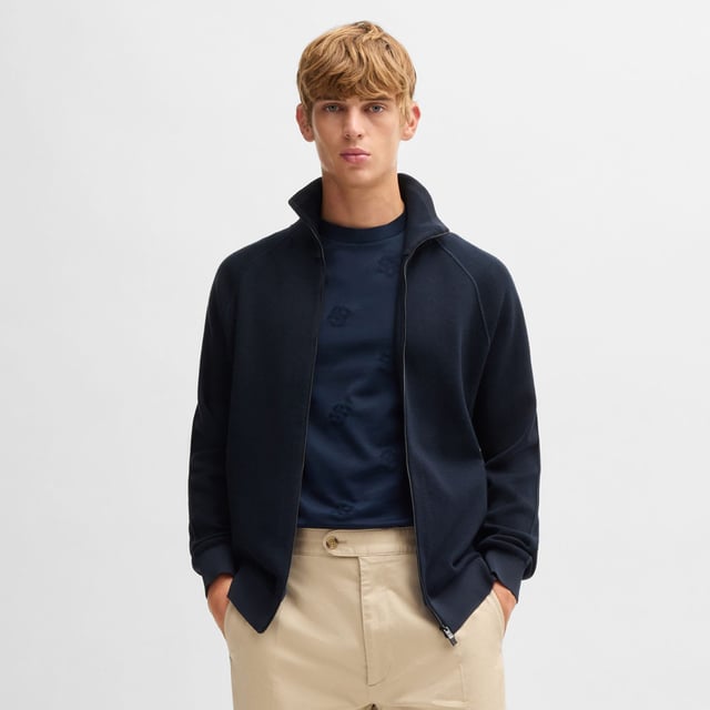 Mens BOSS H-Domico Zip-Up Cardigan in cotton and virgin wool in dark blueA zip-front cardigan with contrasting ribbing by BOSS. This layer is cut to a regular fit and blended with soft virgin wool. This product is partly made with organic cotton. Our organic standards do not allow the use of synthetic fertilisers  pesticides or genetically modified seeds.- Regular fit- Zip neck- Long sleeves- Pockets top: Zip pockets- Standard length- Main material: 70% Cotton  30% Virgin wool.  Ribbing: 100% Polyester.  Machine washable.- Ref: 50519629-405