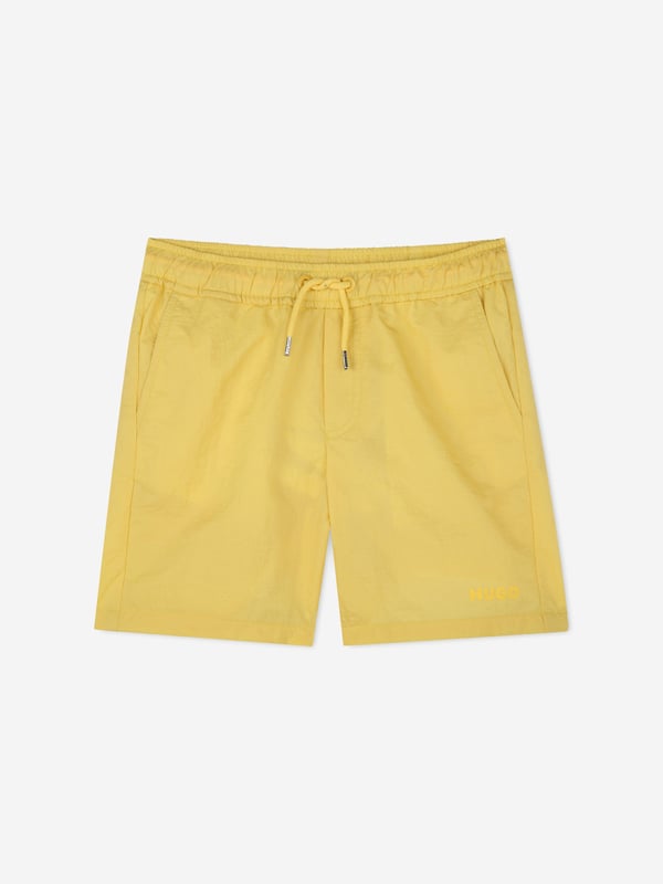 Introducing the exquisite Boys Logo Print Swim Shorts in Yellow by Hugo. Perfect for SS2025, these shorts blend premier style with comfort for the discerning young gentleman Vibrant Yellow Hue Eye-catching and cheerful, ideal for summer fun. Signature Hugo Print Bold and stylish, ensuring your boy stands out. Luxurious Comfort Crafted from superior materials for all-day ease. Elevate your boy's wardrobe with Hugo's designer touch. Shop now and infuse his summer with flair!