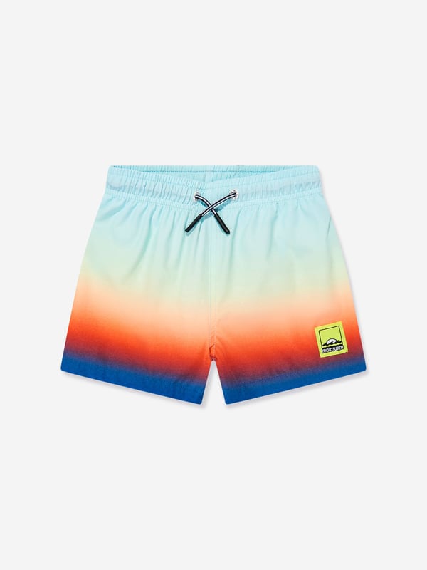Elevate your young gentleman's summer wardrobe with the Boys Niko Fade Swim Shorts in Blue UPF50 from Molo. Perfect for the stylish SS2025 season, these shorts blend function with fashion flawlessly. Here's why they're essential Striking Ombre Design Seamlessly transitions from light to dark blue, ensuring your boy stays at the forefront of beachside fashion. Enhanced Sun Protection Crafted with UPF50 fabric, these shorts offer superior UV defence, keeping playtime safe and sunburn at bay. Supreme Fabric Quality Breathable, quick-drying material ensures comfort during both aquatic and land activities.Step up his style game with Molo's latest. Shop today!