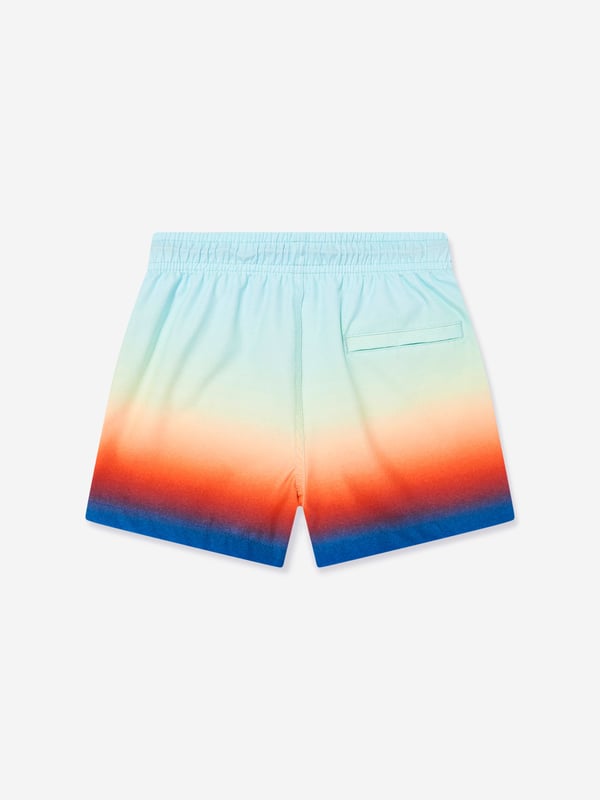 Elevate your young gentleman's summer wardrobe with the Boys Niko Fade Swim Shorts in Blue UPF50 from Molo. Perfect for the stylish SS2025 season, these shorts blend function with fashion flawlessly. Here's why they're essential Striking Ombre Design Seamlessly transitions from light to dark blue, ensuring your boy stays at the forefront of beachside fashion. Enhanced Sun Protection Crafted with UPF50 fabric, these shorts offer superior UV defence, keeping playtime safe and sunburn at bay. Supreme Fabric Quality Breathable, quick-drying material ensures comfort during both aquatic and land activities.Step up his style game with Molo's latest. Shop today!