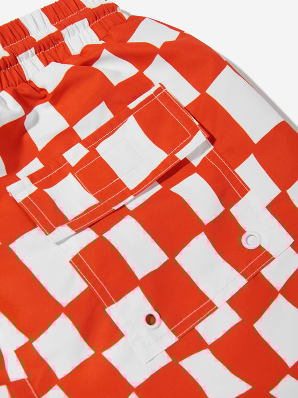 Unveil timeless elegance with the Boys Checked Swim Shorts in Red, crafted by Stella McCartney for SS2025. An essential addition to any boy's wardrobe, these shorts marry classic sophistication with modern flair. Key features include Iconic Check Design Celebrate summer with a chic, red checked pattern that promises both style and distinction. Premium Fabric Constructed from high-quality, soft fabric ensuring lasting comfort and durability. Designer Appeal A signature Stella McCartney creation, perfect for fashionable young individuals.Embrace a stylish summer with these exquisite shorts. Order now!