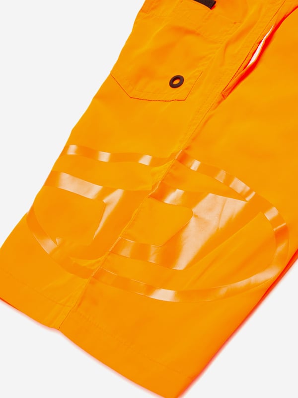 Introducing the Boys Oval D Logo Swim Shorts in Orange by Diesel, an essential addition to your young trendsetter's SS2025 wardrobe. Each detail is meticulously crafted to blend high fashion with functionality Signature Oval D Emblem A mark of high-end style from Diesel, prominently featured. Vibrant Orange Hue Eye-catching and perfect for sunny summer days. Premium Material Guarantees durability and comfort during swim and play.Elevate your boys swimwear collection with these chic and playful shorts. Available now for the fashion-forward youth!
