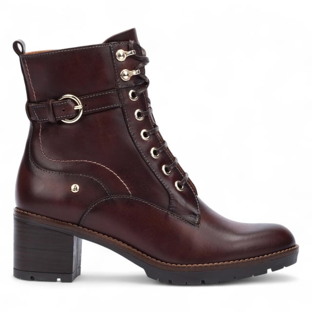 Step into timeless comfort with the Pikolinos Llanes ankle boots – a perfect blend of elegance, functionality, and warmth for colder days. Crafted from premium calfskin leather, these boots feature a flattering 6 cm mid heel and padded insoles for lasting comfort. With a stylish lace-up front and convenient side zip, the Llanes boots are designed to keep your feet supported while elevating your look. Whether you're heading out for errands or styling up for the evening, these boots deliver all-day ease with classic sophistication.

Key Features:
Upper: 100% calfskin leather for a premium, durable finish
Lining: 75% textile and 25% pig skin for a soft, breathable interior
Sole: 100% synthetic for long-lasting grip and flexibility
Closure: Lace-up front with side zip for easy on/off
Heel Height: 6 cm (2.36") flattering mid heel
Shaft Height: 13 cm (5.12"); Shaft Contour: 25 cm (9.84")
Features: Extra comfort insoles for all-day support
Style: Elegant and versatile – ideal for cold weather wear