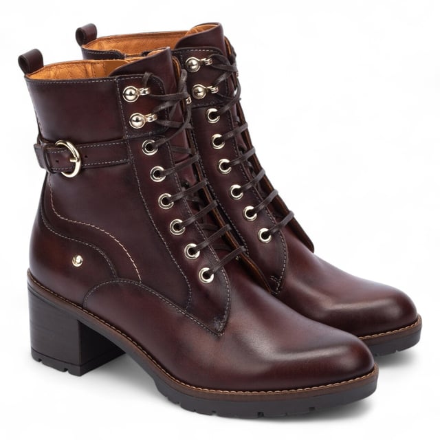 Step into timeless comfort with the Pikolinos Llanes ankle boots – a perfect blend of elegance, functionality, and warmth for colder days. Crafted from premium calfskin leather, these boots feature a flattering 6 cm mid heel and padded insoles for lasting comfort. With a stylish lace-up front and convenient side zip, the Llanes boots are designed to keep your feet supported while elevating your look. Whether you're heading out for errands or styling up for the evening, these boots deliver all-day ease with classic sophistication.

Key Features:
Upper: 100% calfskin leather for a premium, durable finish
Lining: 75% textile and 25% pig skin for a soft, breathable interior
Sole: 100% synthetic for long-lasting grip and flexibility
Closure: Lace-up front with side zip for easy on/off
Heel Height: 6 cm (2.36") flattering mid heel
Shaft Height: 13 cm (5.12"); Shaft Contour: 25 cm (9.84")
Features: Extra comfort insoles for all-day support
Style: Elegant and versatile – ideal for cold weather wear
