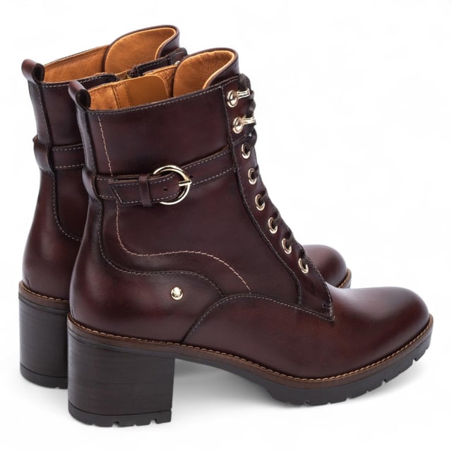 Step into timeless comfort with the Pikolinos Llanes ankle boots – a perfect blend of elegance, functionality, and warmth for colder days. Crafted from premium calfskin leather, these boots feature a flattering 6 cm mid heel and padded insoles for lasting comfort. With a stylish lace-up front and convenient side zip, the Llanes boots are designed to keep your feet supported while elevating your look. Whether you're heading out for errands or styling up for the evening, these boots deliver all-day ease with classic sophistication.

Key Features:
Upper: 100% calfskin leather for a premium, durable finish
Lining: 75% textile and 25% pig skin for a soft, breathable interior
Sole: 100% synthetic for long-lasting grip and flexibility
Closure: Lace-up front with side zip for easy on/off
Heel Height: 6 cm (2.36") flattering mid heel
Shaft Height: 13 cm (5.12"); Shaft Contour: 25 cm (9.84")
Features: Extra comfort insoles for all-day support
Style: Elegant and versatile – ideal for cold weather wear