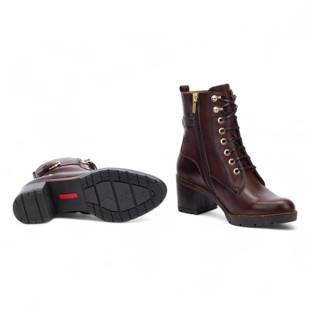 Step into timeless comfort with the Pikolinos Llanes ankle boots – a perfect blend of elegance, functionality, and warmth for colder days. Crafted from premium calfskin leather, these boots feature a flattering 6 cm mid heel and padded insoles for lasting comfort. With a stylish lace-up front and convenient side zip, the Llanes boots are designed to keep your feet supported while elevating your look. Whether you're heading out for errands or styling up for the evening, these boots deliver all-day ease with classic sophistication.

Key Features:
Upper: 100% calfskin leather for a premium, durable finish
Lining: 75% textile and 25% pig skin for a soft, breathable interior
Sole: 100% synthetic for long-lasting grip and flexibility
Closure: Lace-up front with side zip for easy on/off
Heel Height: 6 cm (2.36") flattering mid heel
Shaft Height: 13 cm (5.12"); Shaft Contour: 25 cm (9.84")
Features: Extra comfort insoles for all-day support
Style: Elegant and versatile – ideal for cold weather wear