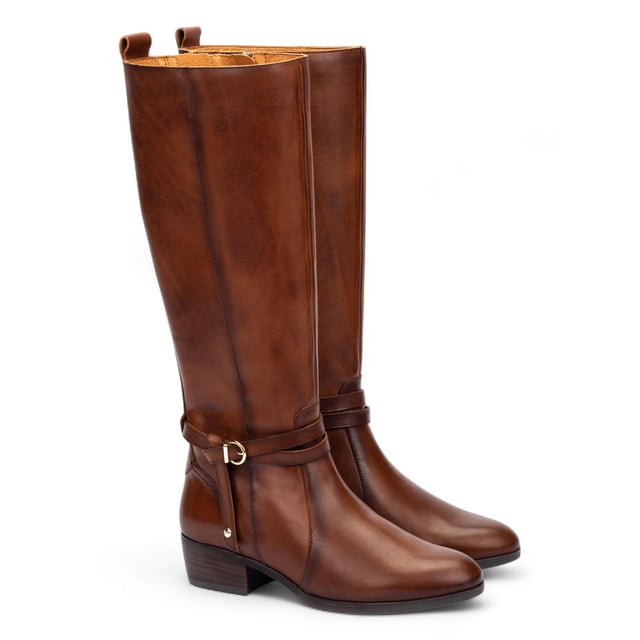 Step confidently into timeless style with the Pikolinos Daroca tall boots, expertly crafted from 100% calfskin leather for a polished, rich finish. Designed to offer exceptional comfort with a cushioned insole and a supportive 4 cm (1.57”) heel, these boots strike the perfect balance between form and function. The sleek, equestrian-inspired silhouette is accented with elegant strap and buckle detailing, making them a versatile wardrobe essential for cooler seasons.

Key Features:

Upper: 100% premium calfskin leather for durability and a refined look
Inner lining: Soft textile and pigskin blend (75% textile, 25% pigskin) for breathable, all-day comfort
Insole: Cushioned insole for enhanced walking support
Sole: 100% synthetic for long-lasting wear
Closure: Side zip fastening for easy wearability
Heel height: 4 cm (1.57”) for subtle elevation
Shaft contour: 38 cm (14.96”) based on EU size 37
Shaft height: 37.5 cm (14.76”) based on EU size 37