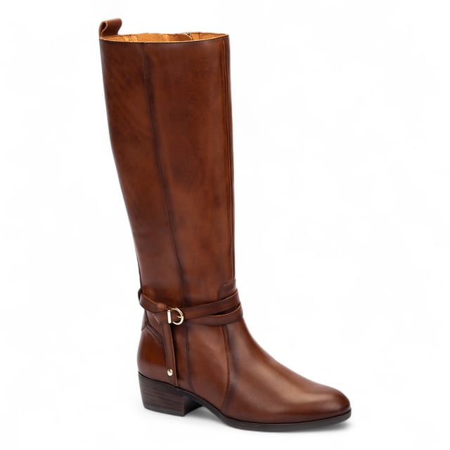 Step confidently into timeless style with the Pikolinos Daroca tall boots, expertly crafted from 100% calfskin leather for a polished, rich finish. Designed to offer exceptional comfort with a cushioned insole and a supportive 4 cm (1.57”) heel, these boots strike the perfect balance between form and function. The sleek, equestrian-inspired silhouette is accented with elegant strap and buckle detailing, making them a versatile wardrobe essential for cooler seasons.

Key Features:

Upper: 100% premium calfskin leather for durability and a refined look
Inner lining: Soft textile and pigskin blend (75% textile, 25% pigskin) for breathable, all-day comfort
Insole: Cushioned insole for enhanced walking support
Sole: 100% synthetic for long-lasting wear
Closure: Side zip fastening for easy wearability
Heel height: 4 cm (1.57”) for subtle elevation
Shaft contour: 38 cm (14.96”) based on EU size 37
Shaft height: 37.5 cm (14.76”) based on EU size 37