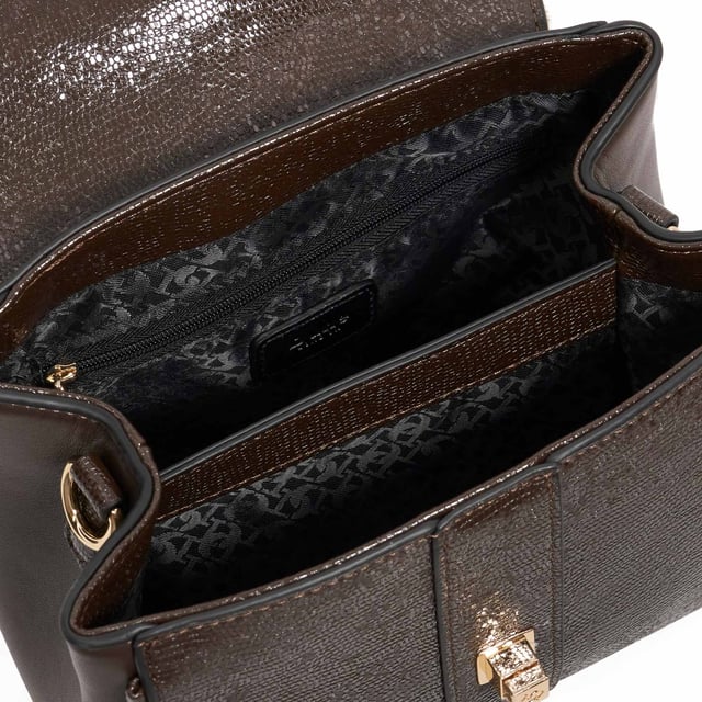 Dassios is the chic day bag that balances polish with practicality. Crafted with a contrasting textured side panel for a subtle style twist, it features a sleek turn-lock closure and a structured top handle for timeless appeal. Inside, the monogrammed lining reveals two spacious compartments ' one zipped for added security ' keeping your essentials neatly organised. Carry it by hand for a sophisticated look, or attach the optional long strap for a hands-free cross-body style. Finished with a removable logo and plush faux-fur pom-pom charm, Dassios is your go-to for effortless everyday elegance