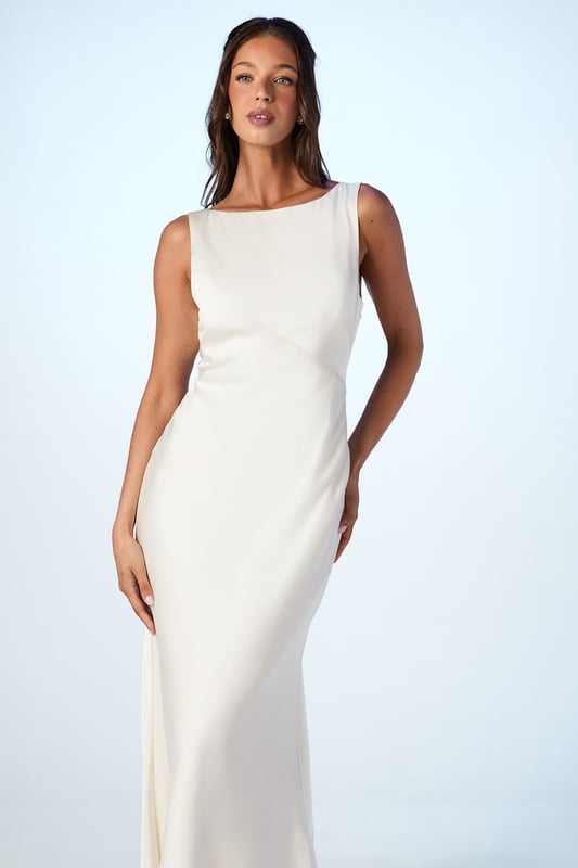 Elegant satin maxi dress with a sophisticated square neckline
        Striking V-back design with a dramatic sash detail that flows beautifully
        Figure-flattering silhouette with a floor-sweeping maxi length
        Sleeveless design perfect for formal wedding celebrations
        Smooth satin fabric creates a luxurious drape and refined finish
    
    This stunning Coast bridesmaid dress combines timeless elegance with contemporary design elements. The clean lines of the square neckline create a graceful frame for the dcolletage, whilst the dramatic V-back with flowing sash detail adds unexpected visual interest when you turn. The sleek silhouette skims the body beautifully before extending to a floor-length finish, creating a sophisticated and elongating effect. Style with delicate strappy heels and refined jewellery for a coordinated bridal party look. The versatile design allows for various styling options within your wedding colour palette, making it ideal for creating a cohesive yet distinctive bridesmaid ensemble. This dress strikes the perfect balance between understated refinement and special occasion glamour, ensuring you feel confident and elegant whilst supporting the bride on her special day.