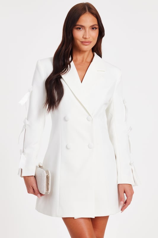 - Double breasted - Bow sleeves - Button front - Tailored look - Model height: 5'6" - Model wears uk 8 / us 4 / eur 36 - Always check the wash care label - Cool hand wash with mild detergent