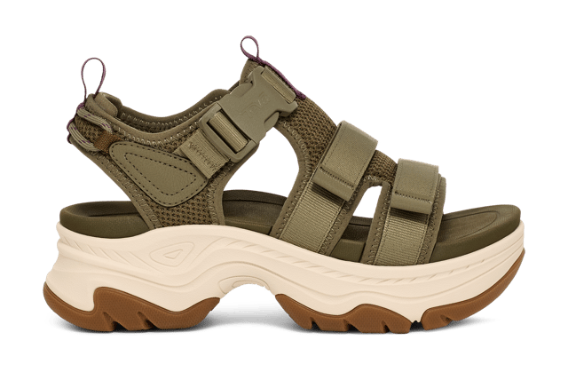 TEVA WOMENS HURRICANE AMPSOLE GAILA BURNT OLIVE An elevated platform sandal that features outdoor-inspired design details, the Hurricane Ampsole Gaila takes our iconic Hurricane to new heights with a fresh bottom unit inspired by mountain peaks. We’ve doubled down on comfort features, lining our quick-dry straps with extra padding, adding a chunky, rubberized sole for toothy traction, and finishing with a ticked rope on the heel that ties back to our river roots