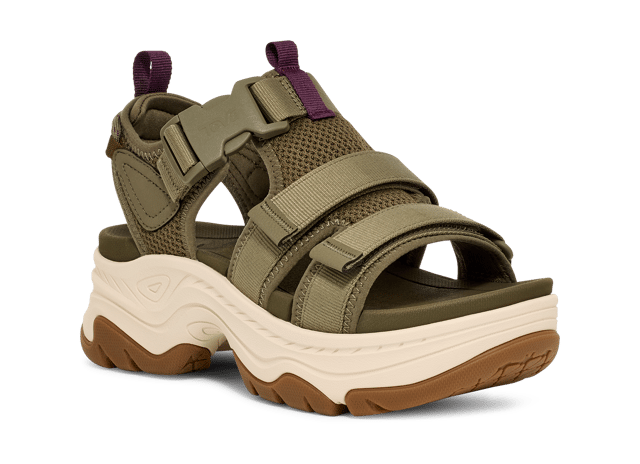 TEVA WOMENS HURRICANE AMPSOLE GAILA BURNT OLIVE An elevated platform sandal that features outdoor-inspired design details, the Hurricane Ampsole Gaila takes our iconic Hurricane to new heights with a fresh bottom unit inspired by mountain peaks. We’ve doubled down on comfort features, lining our quick-dry straps with extra padding, adding a chunky, rubberized sole for toothy traction, and finishing with a ticked rope on the heel that ties back to our river roots
