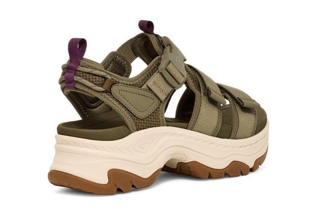 TEVA WOMENS HURRICANE AMPSOLE GAILA BURNT OLIVE An elevated platform sandal that features outdoor-inspired design details, the Hurricane Ampsole Gaila takes our iconic Hurricane to new heights with a fresh bottom unit inspired by mountain peaks. We’ve doubled down on comfort features, lining our quick-dry straps with extra padding, adding a chunky, rubberized sole for toothy traction, and finishing with a ticked rope on the heel that ties back to our river roots