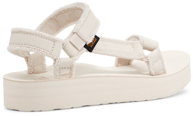 TEVA WOMENS MIDFORM UNIVERSAL CANVAS BIRCH Amp up your summer with this metallic studded stunner. Cut from premium leather, our ultra-soft straps have been embellished with studs and paired with a cushy EVA footbed and roam-ready rubber sole to tackle wherever the day takes you