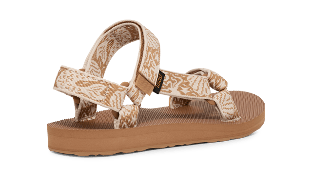 TEVA WOMENS ORIGINAL UNIVERSAL SIRENA TANZINE From a Grand Canyon raft in 1984 to docks, stoops, and sidewalks around the world, one of Teva’s very first sandal stands as a testament to timeless comfort and utilitarian style.