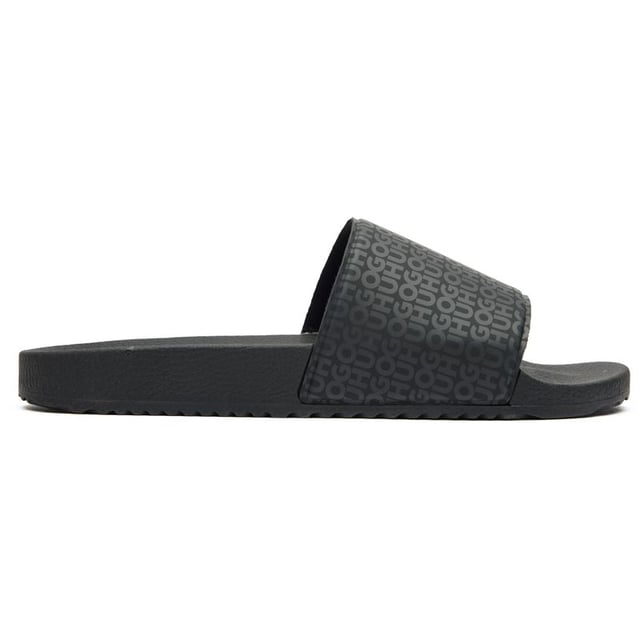 Sleek and sophisticated, the Hugo Timein slides in classic black offer comfort without compromising on style. These rubber sandals boast a contoured footbed that cradles your feet for all-day wearability. The textured outsole provides reliable grip, making them perfect for poolside lounging or casual summer outings. Effortlessly cool with HUGO's signature aesthetic, these slides combine practicality and contemporary design for the modern man.