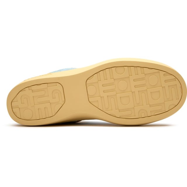 The Good News Lagoon trainers blend effortless style with eco-conscious design in a beautiful blue hue. Crafted from handmade deadstock suede with a distinctive stamped GN motif, these casual court-inspired shoes deliver laid-back sophistication. The chunky organic cotton laces add character, while recycled mesh lining ensures comfort all day. With their rubber sole providing reliable grip, these sustainable trainers prove that responsible fashion can be both chic and practicalâperfect for the environmentally aware woman who refuses to compromise on style.
