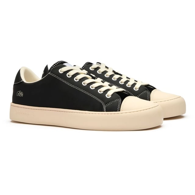 The GOOD NEWS Slimer delivers understated style with serious eco-credentials. These black court trainers combine a sleek bio plant and suede upper with the brand's signature round toe shape for a distinctive silhouette. Comfort comes naturally with the breathable cushioned footbed and 100% recycled foam insole. The recycled rubber sole adds durability while minimizing environmental impact. With minimal branding, these versatile casual trainers offer sustainable style that works effortlessly with any outfit.